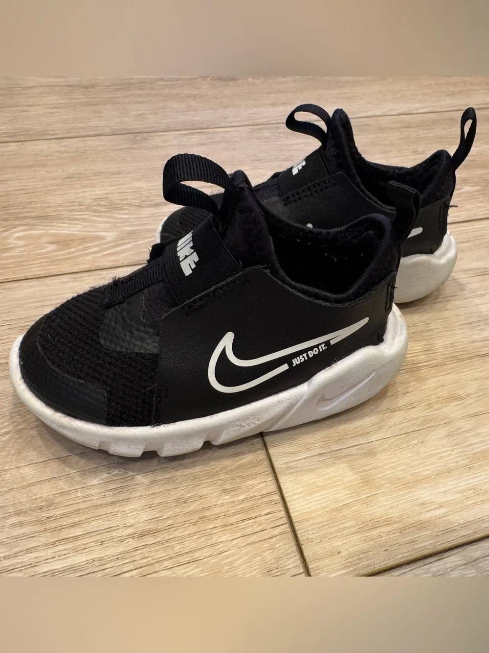 Nike Toddler Black and White Slip-On Sneakers